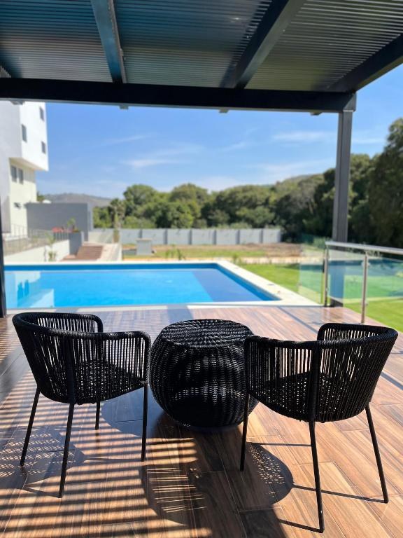 Seating on the terrace beside the pool